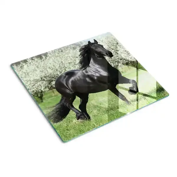 Tabla de cortar de cristal Caballo negro en el prado