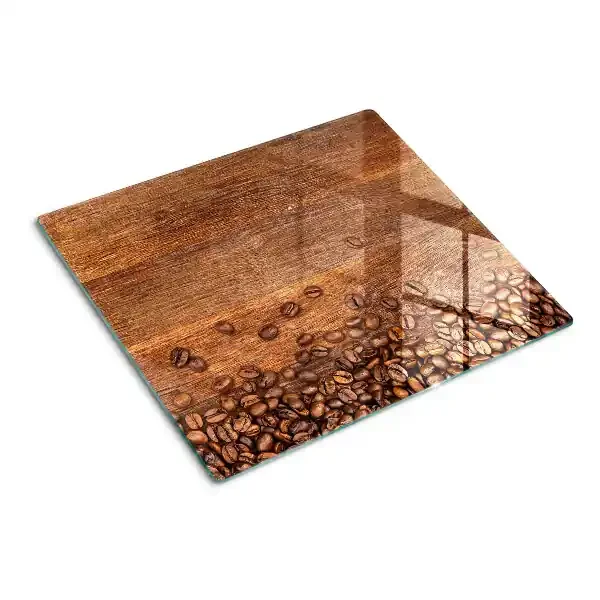 Tabla de cortar de cristal Granos de café sobre fondo de madera