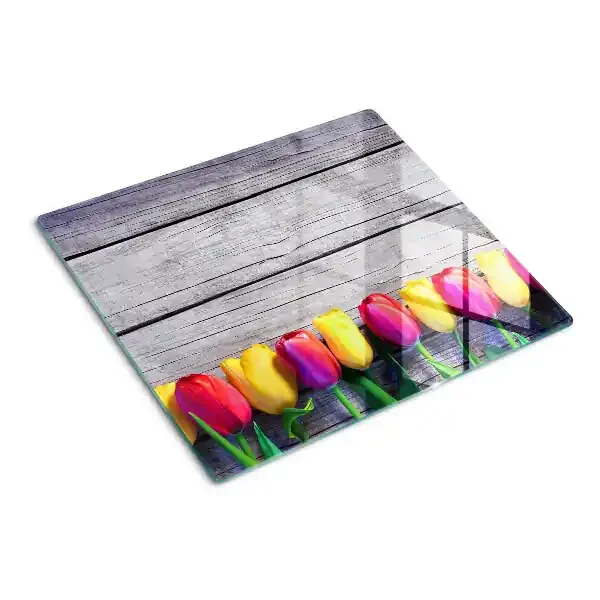 Tabla de cortar de cristal Tulipanes sobre un fondo de madera